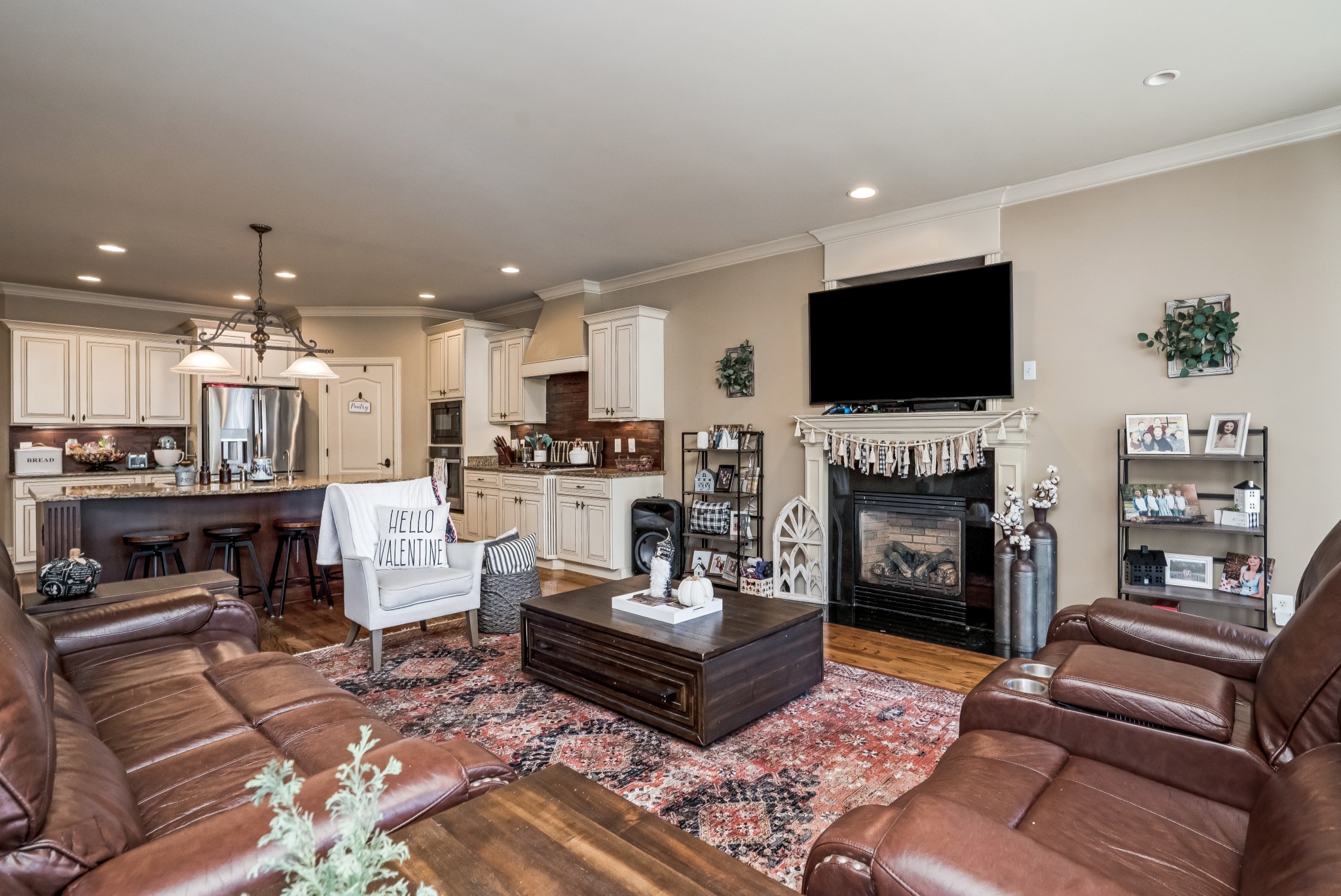 1629 Fair House Road Spring Hill, TN 37174 - Photo 14 of 42 a living room with furniture a fireplace and a flat screen tv