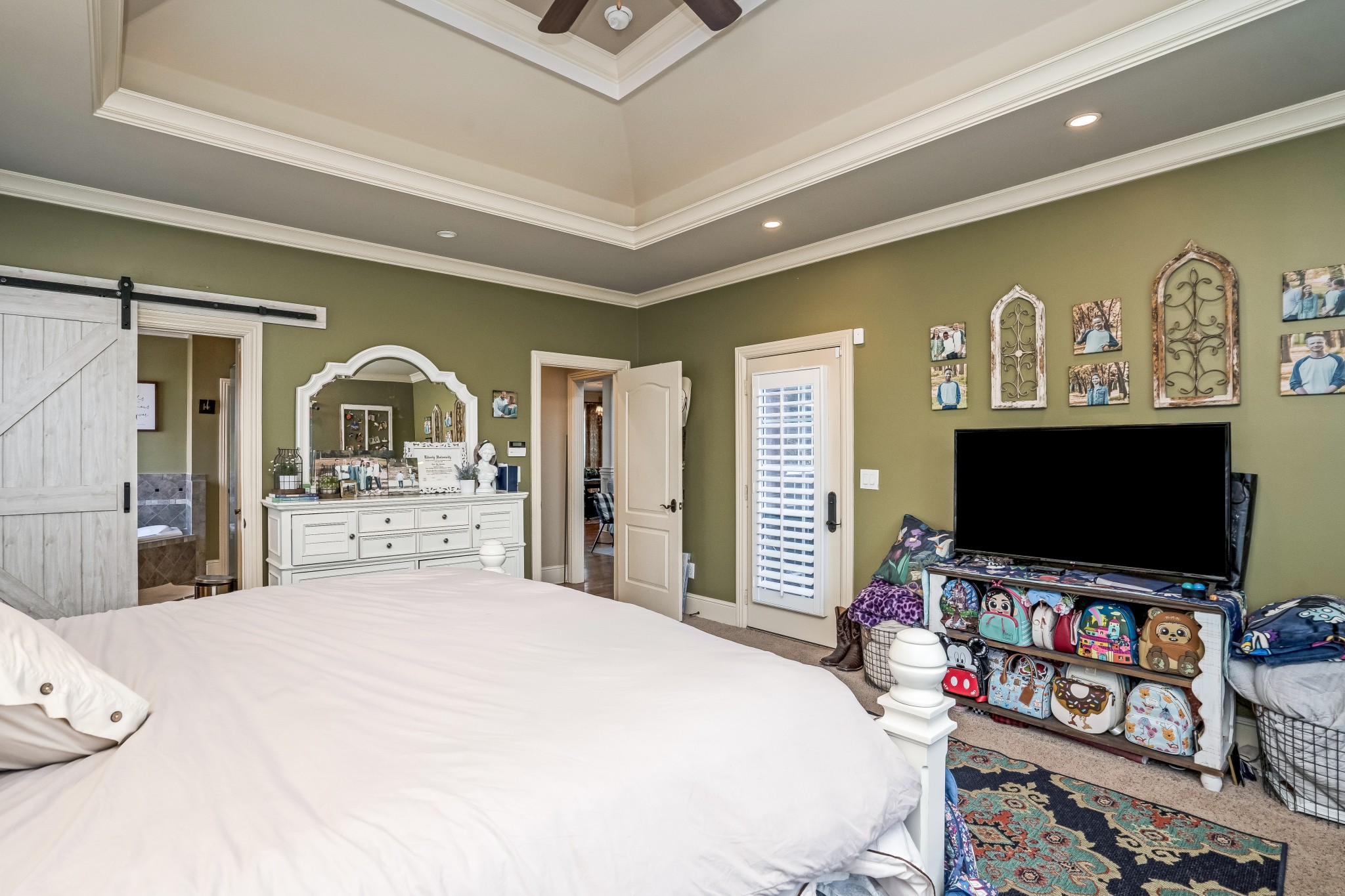 1629 Fair House Road Spring Hill, TN 37174 - Photo 17 of 42 a bedroom with a bed and a flat screen tv