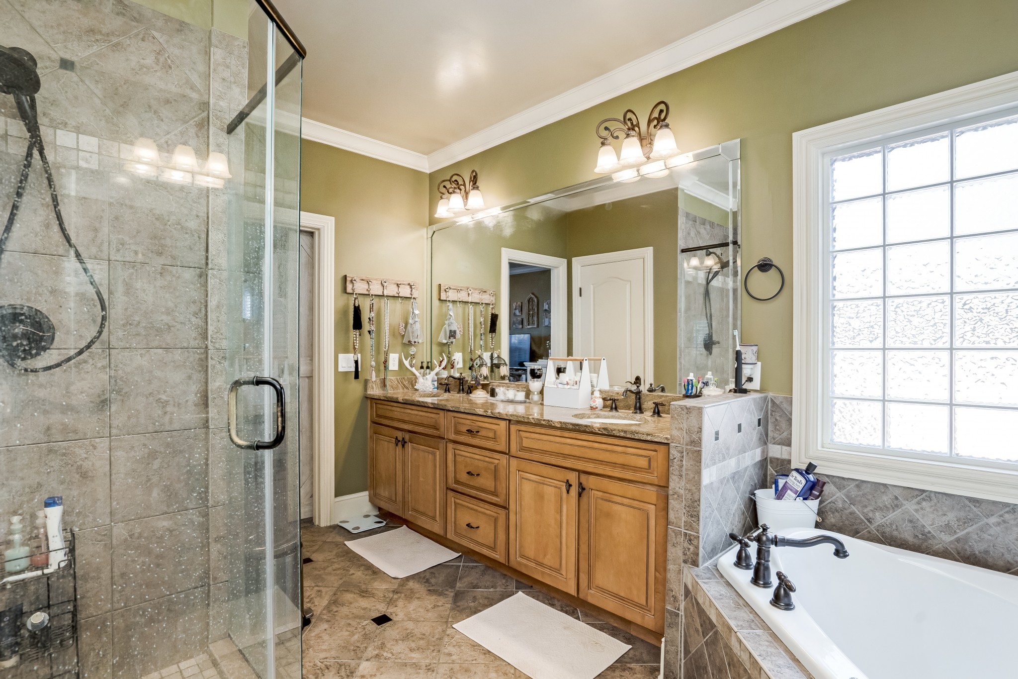 1629 Fair House Road Spring Hill, TN 37174 - Photo 18 of 42 a bathroom with a tub sink toilet and mirror