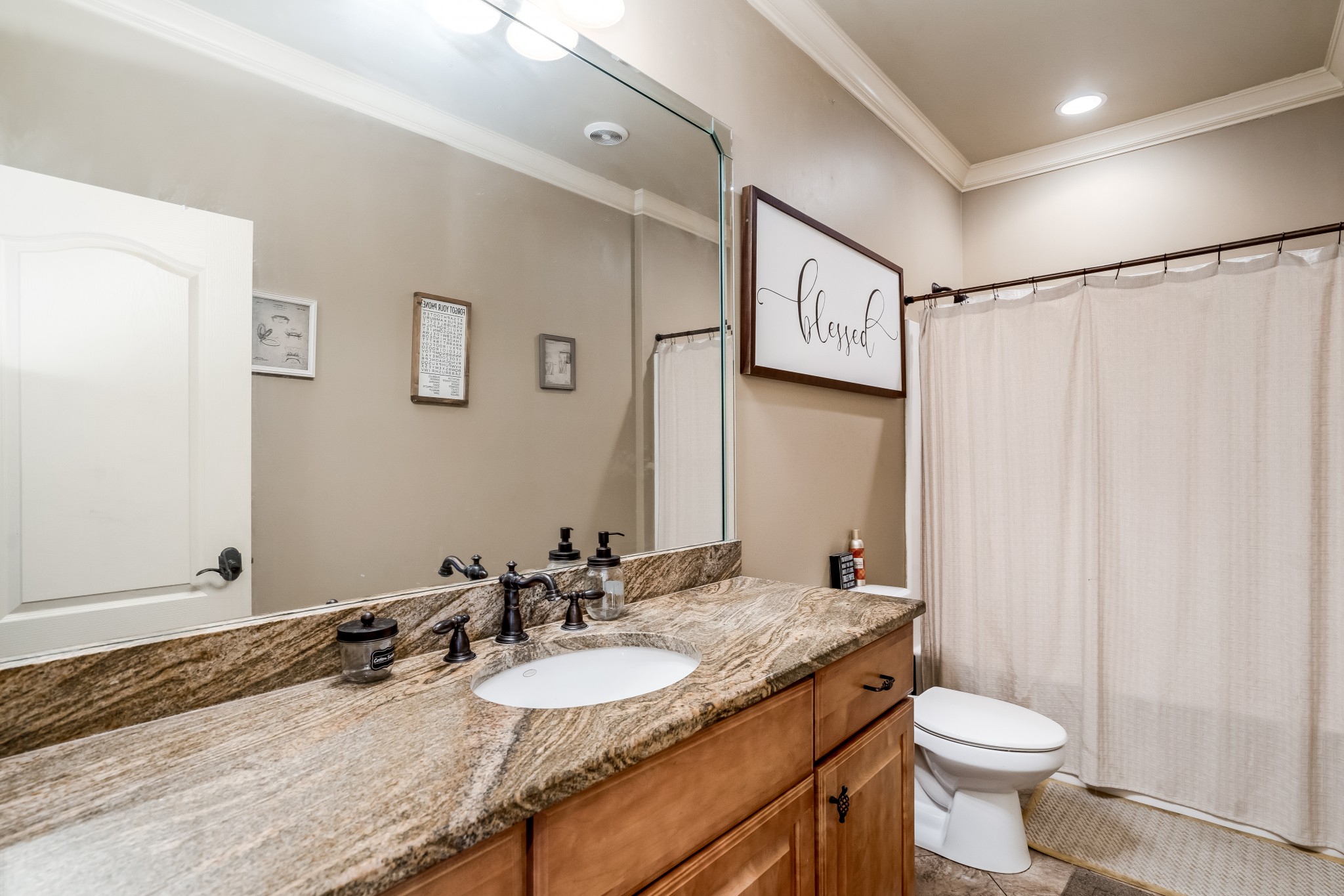 1629 Fair House Road Spring Hill, TN 37174 - Photo 22 of 42 a bathroom with a granite countertop sink toilet and a mirror