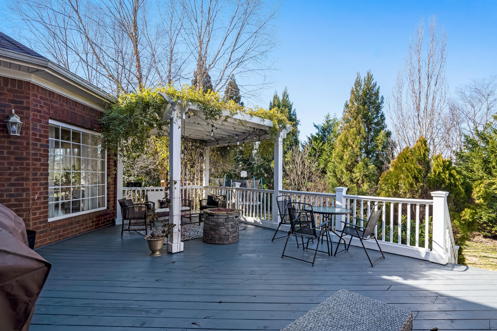 1629 Fair House Road Spring Hill, TN 37174 - Photo 35 of 42 a view of a patio with table and chairs potted plants with wooden floor and fence