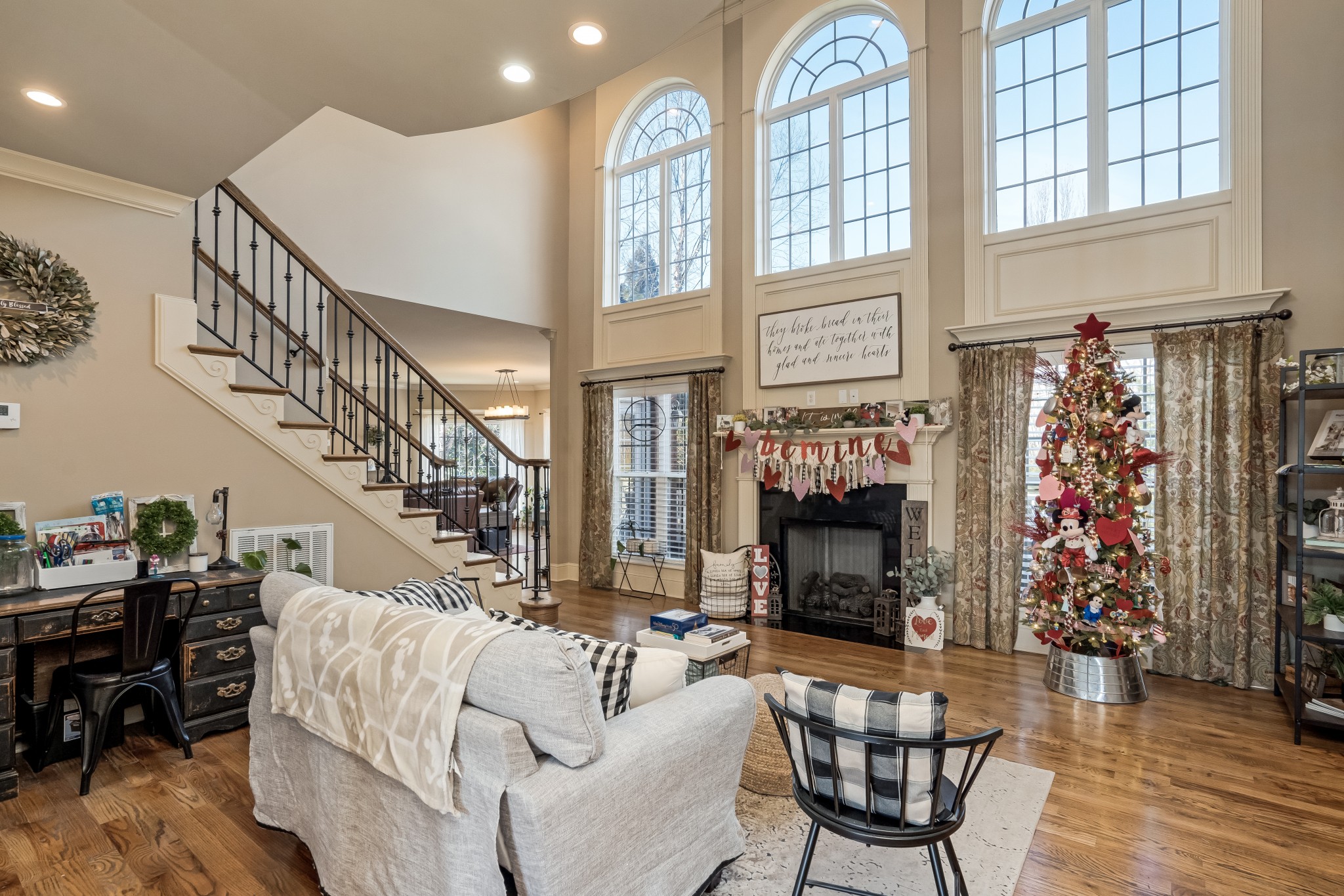 1629 Fair House Road Spring Hill, TN 37174 - Photo 8 of 42 a living room with furniture a fireplace and a chandelier