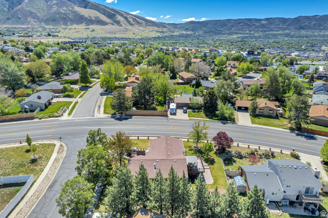12080 Mill Ridge Circle Sandy, UT 84094 - Photo 41 of 56 Aerial perspective showcasing a residential area with varied home styles and mature landscaping