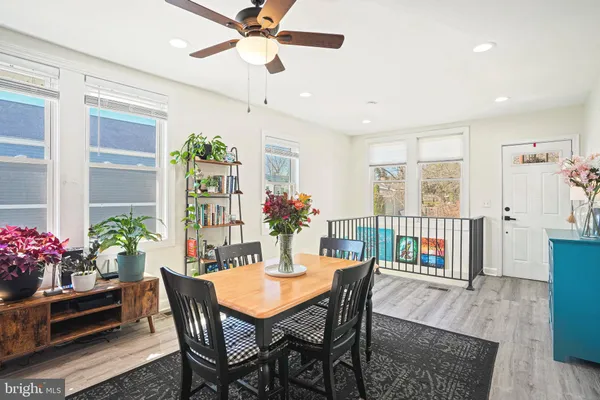 a view of a dining room with furniture and a window