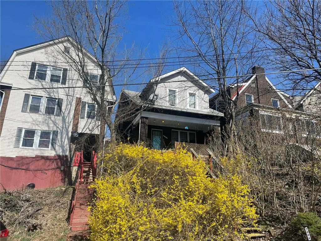 2008 Locust Street Pittsburgh, PA 15218 - Photo 3 of 9 a view of a house with a small yard