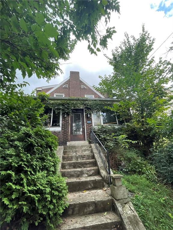 2008 Locust Street Pittsburgh, PA 15218 - Photo 4 of 9 a front view of a house with a yard