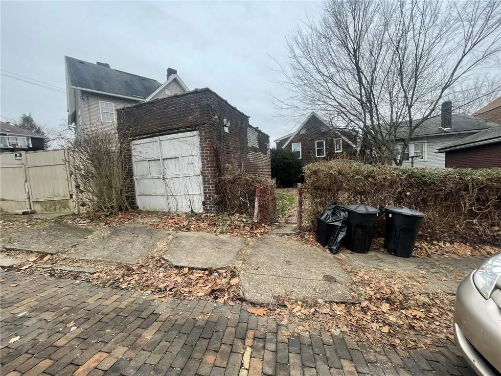 2008 Locust Street Pittsburgh, PA 15218 - Photo 5 of 9 a view of a house with a yard covered in snow