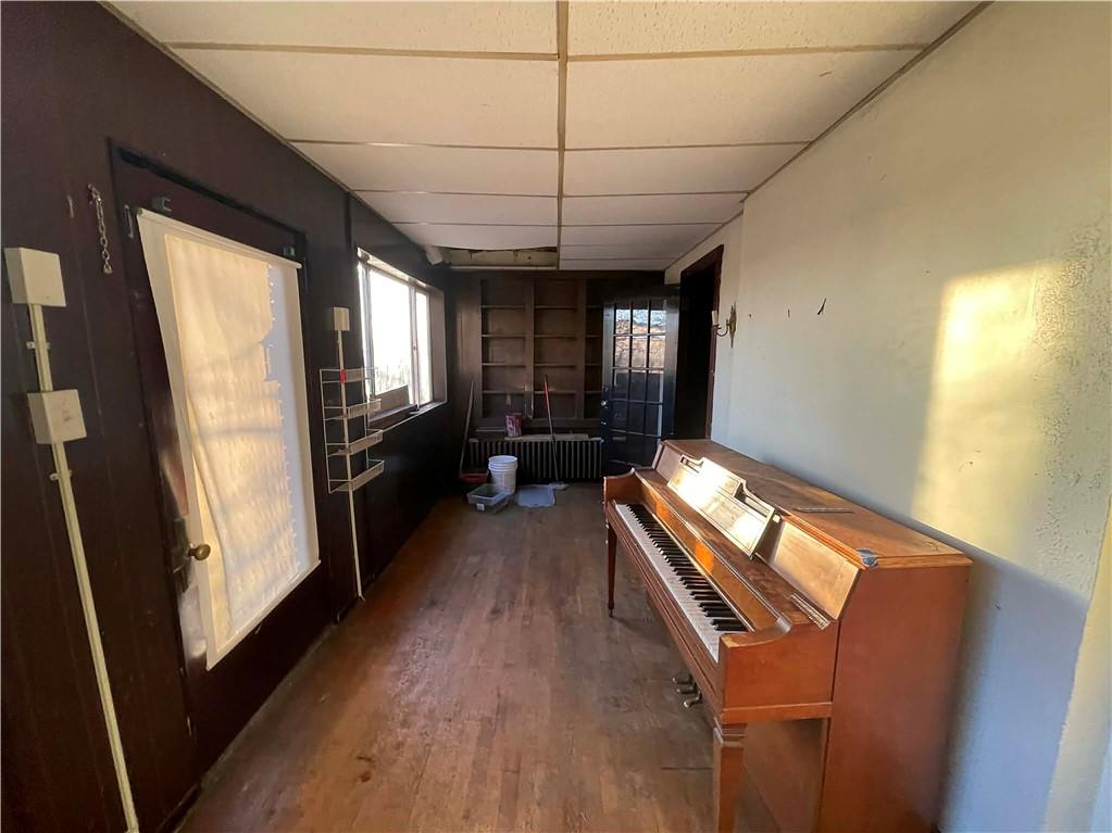 2008 Locust Street Pittsburgh, PA 15218 - Photo 7 of 9 a hallway with furniture and wooden floor