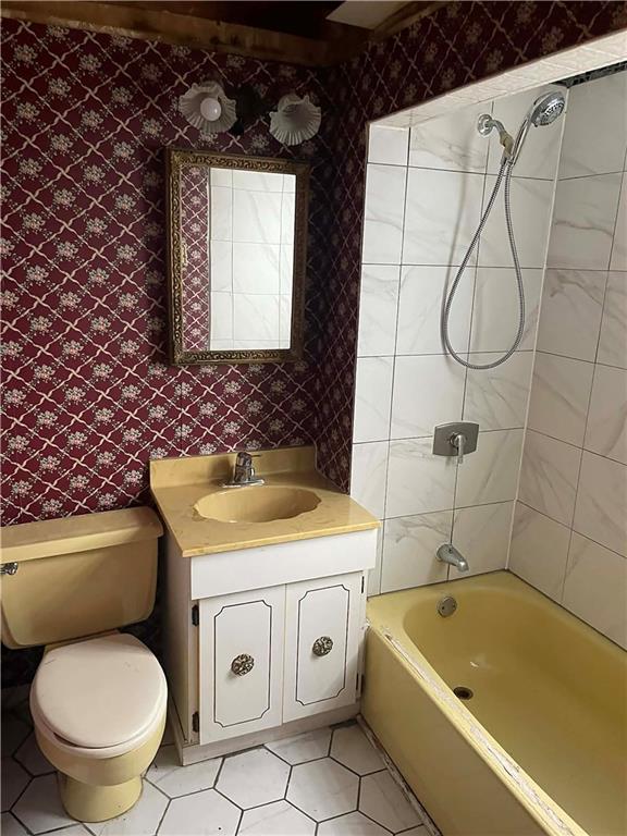 2008 Locust Street Pittsburgh, PA 15218 - Photo 8 of 9 a bathroom with a granite countertop toilet sink and mirror
