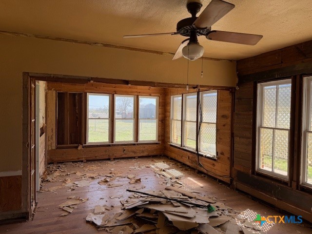 910 County Road 421 Evant, TX 76525 - Photo 16 of 25 a view of empty room with wooden floor and fan