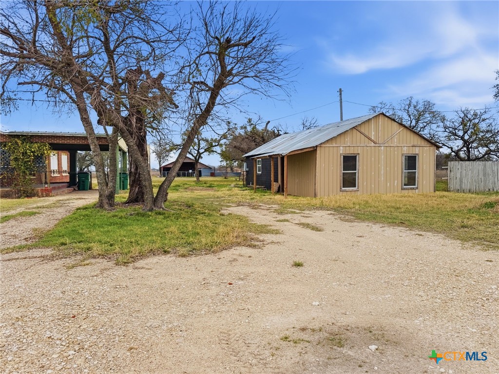 910 County Road 421 Evant, TX 76525 - Photo 3 of 25 a front view of a house with a yard