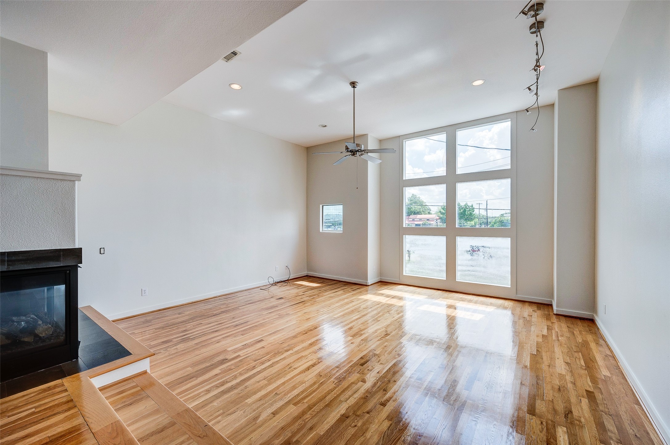 1729 Reinerman Street Houston, TX 77007 - Photo 3 of 31 Living room with wood flooring and gas log fireplace