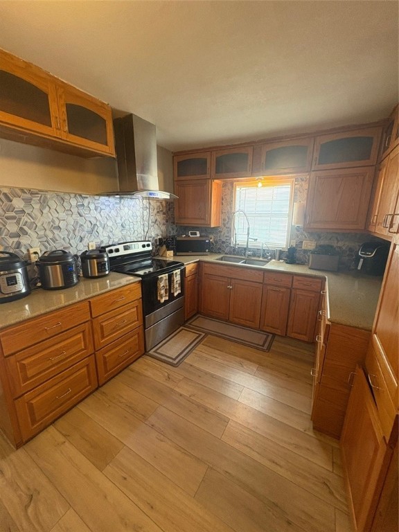 319 Olmito Street Alice, TX 78332 - Photo 4 of 16 a kitchen with stainless steel appliances granite countertop a stove a sink and a microwave