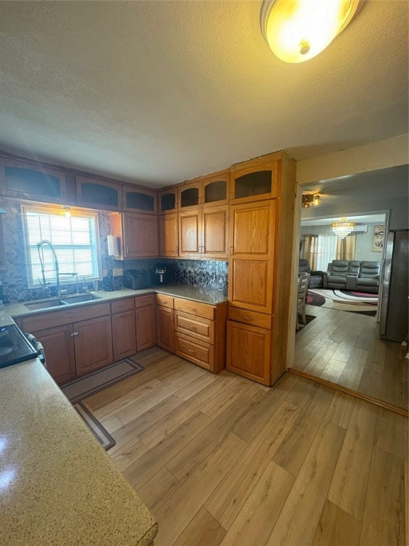 319 Olmito Street Alice, TX 78332 - Photo 5 of 16 a large kitchen with granite countertop a large counter top and stainless steel appliances