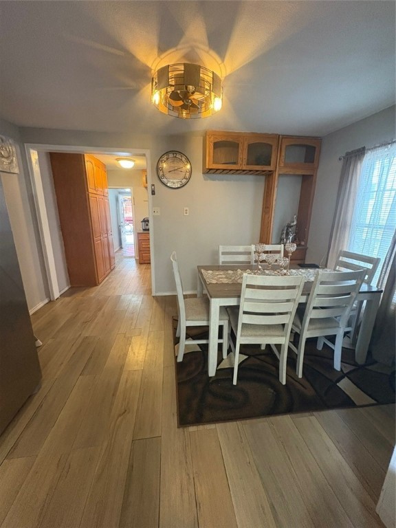 319 Olmito Street Alice, TX 78332 - Photo 6 of 16 a view of a dining room with furniture and a chandelier