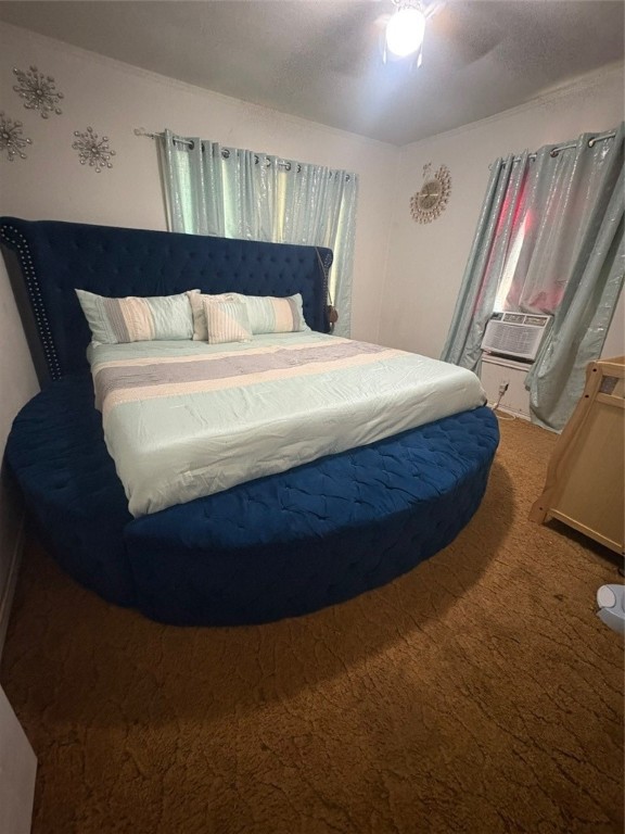 319 Olmito Street Alice, TX 78332 - Photo 10 of 16 a bed sitting in a bedroom next to a window