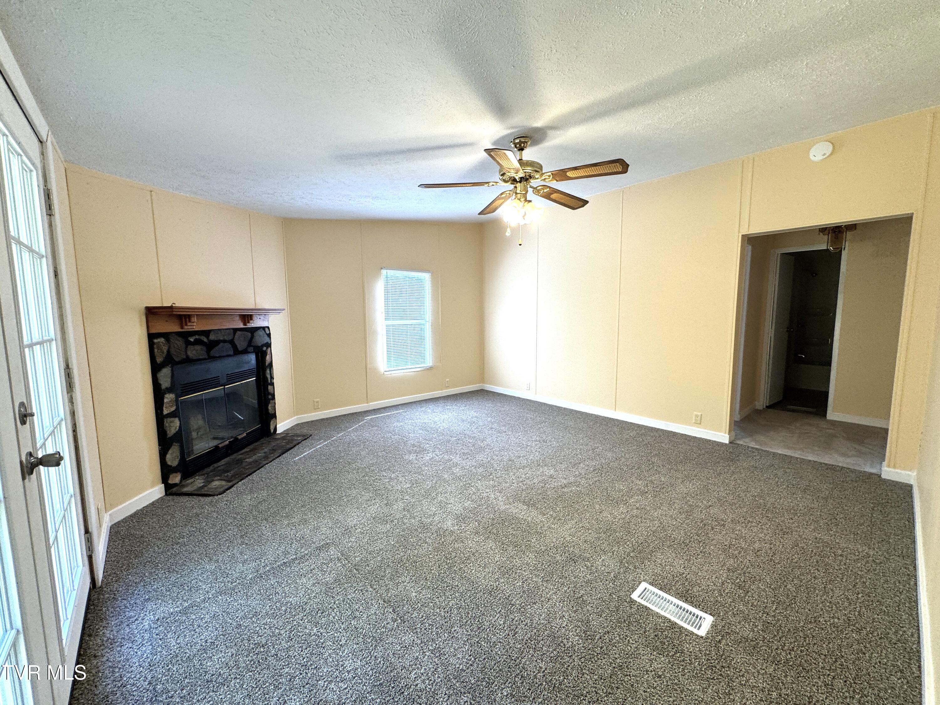 1555 Hamner Hollow Road Big Stone Gap, VA 24219 - Photo 24 of 41 FAMILY ROOM FROM KITCHEN