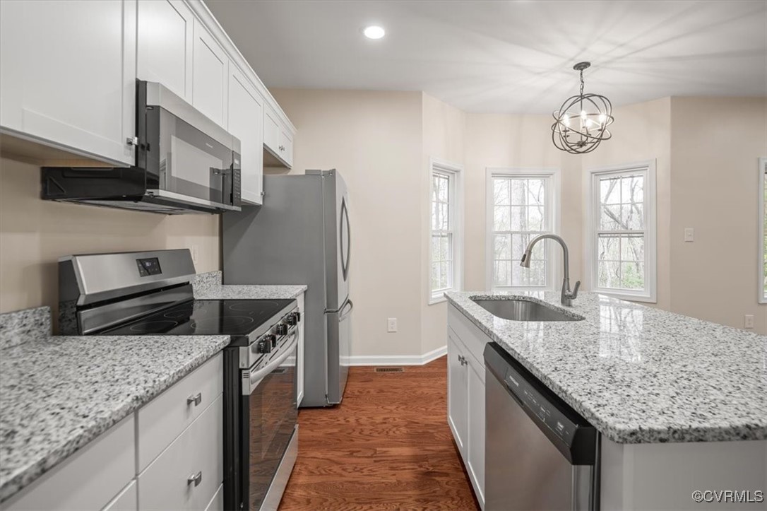 2919 Hog Back Road Hopewell, VA 23860 - Photo 13 of 45 Kitchen with white cabinetry, dark wood-style floo