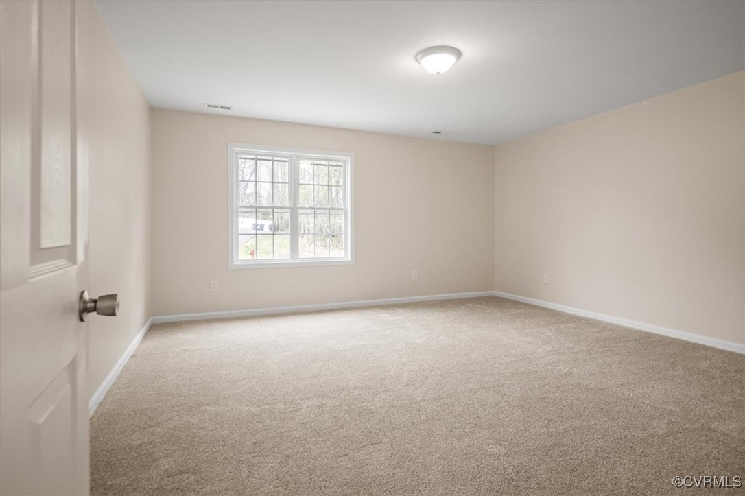 2919 Hog Back Road Hopewell, VA 23860 - Photo 35 of 45 Carpeted empty room with visible vents and baseboa
