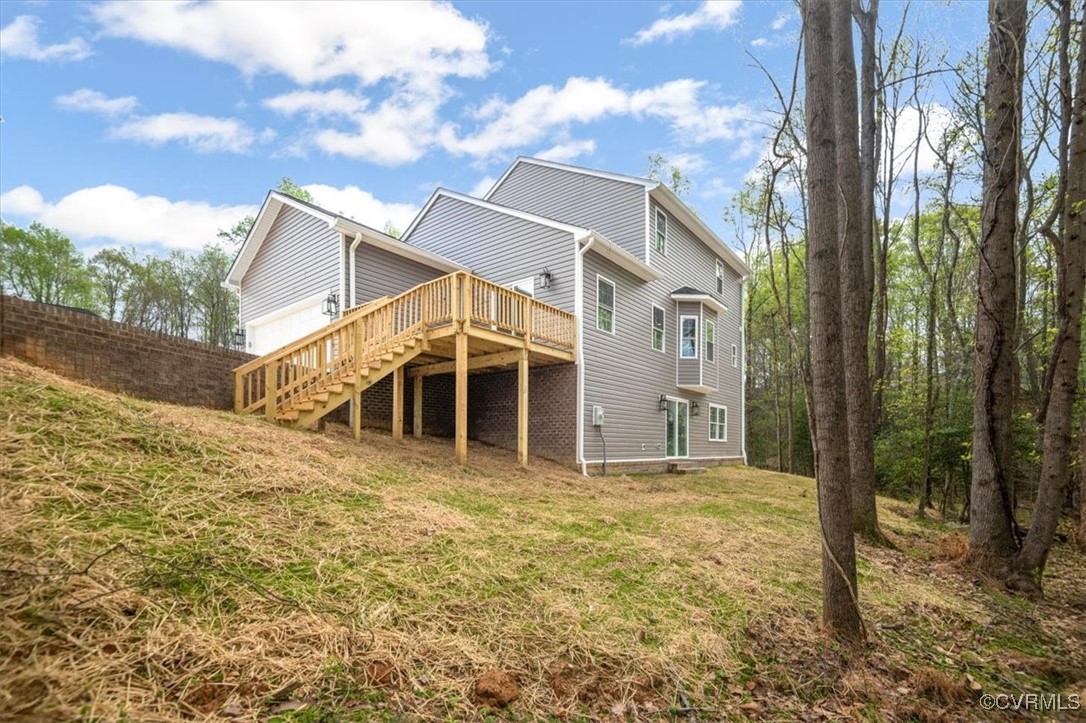 2919 Hog Back Road Hopewell, VA 23860 - Photo 45 of 45 Rear view of house with a wooden deck, a lawn, and