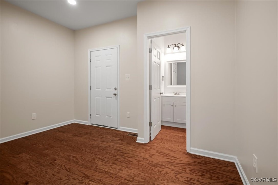 2919 Hog Back Road Hopewell, VA 23860 - Photo 5 of 45 Unfurnished bedroom featuring a sink, baseboards,