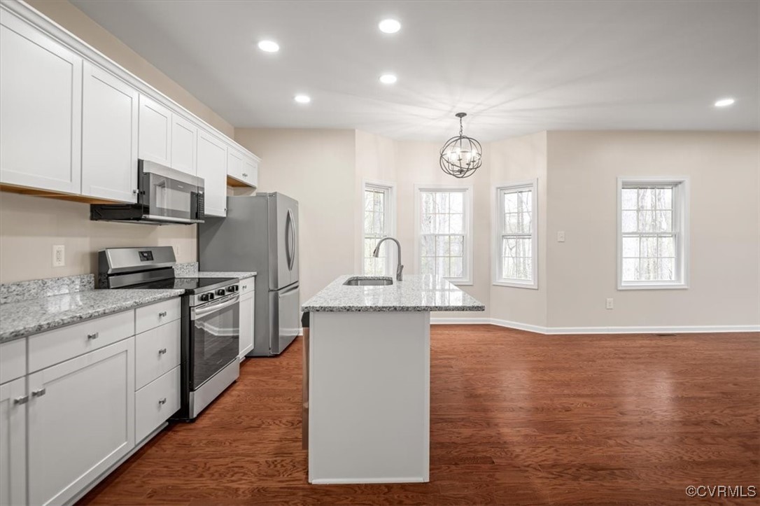 2919 Hog Back Road Hopewell, VA 23860 - Photo 9 of 45 Kitchen featuring a notable chandelier, dark wood-