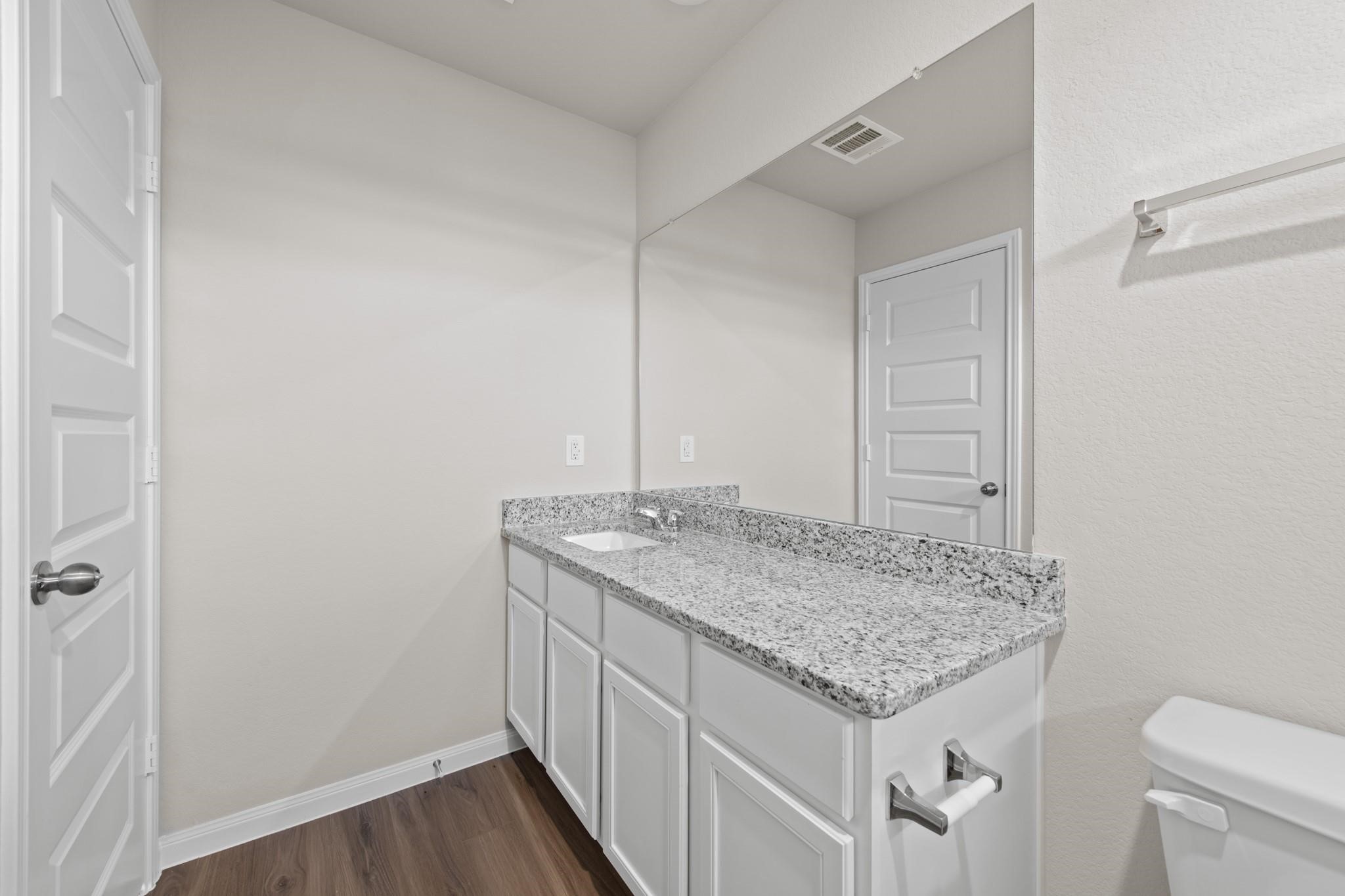 506 Moose Run Huntsville, TX 77320 - Photo 13 of 26 a bathroom with a granite countertop sink and toilet