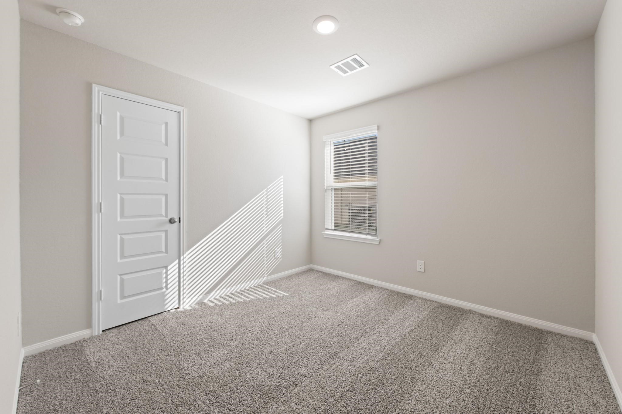 506 Moose Run Huntsville, TX 77320 - Photo 14 of 26 an empty room with windows