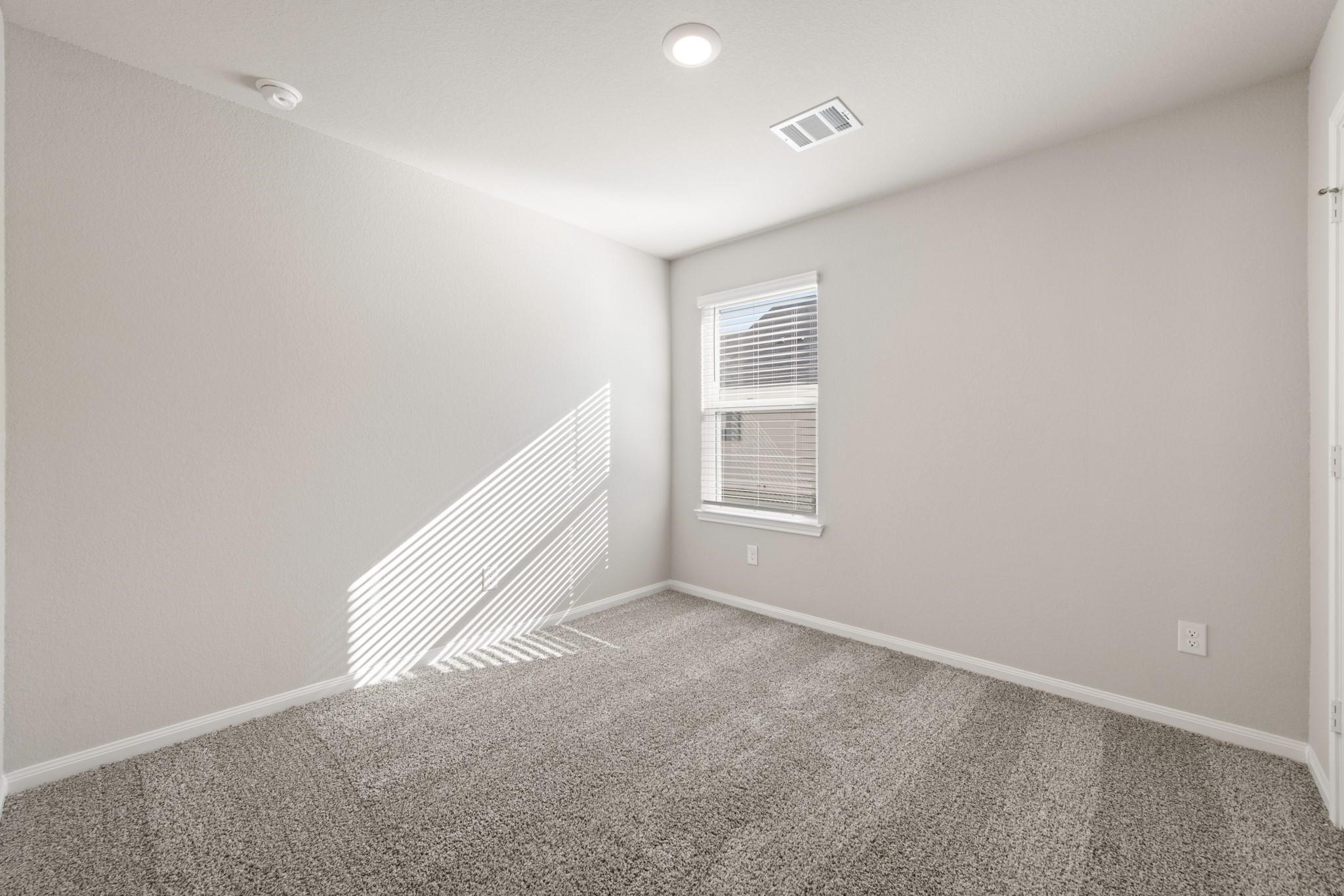 506 Moose Run Huntsville, TX 77320 - Photo 15 of 26 an empty room with windows