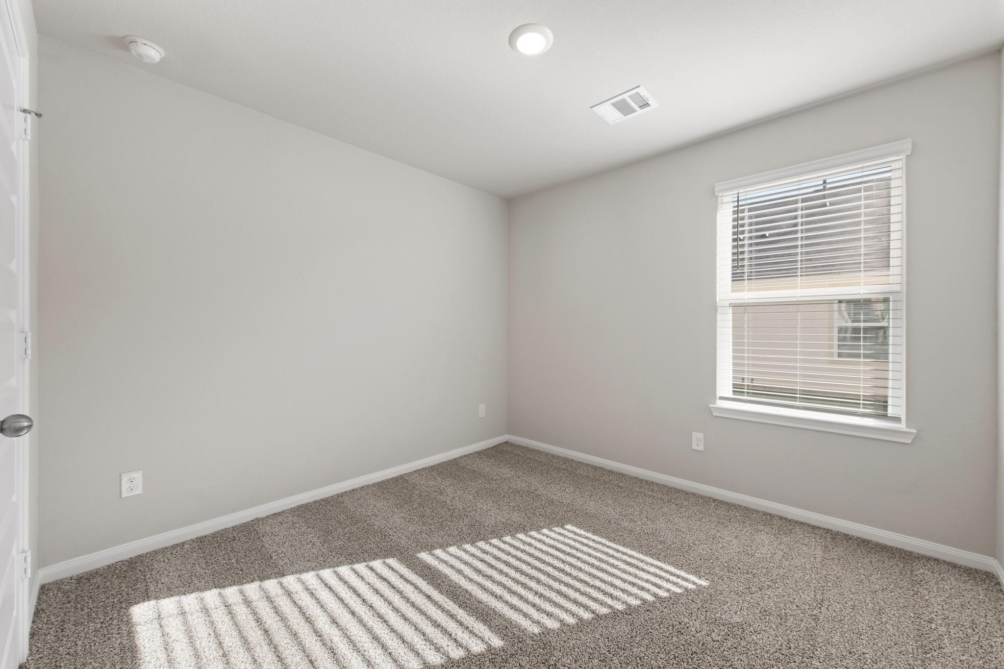 506 Moose Run Huntsville, TX 77320 - Photo 16 of 26 an empty room with a window