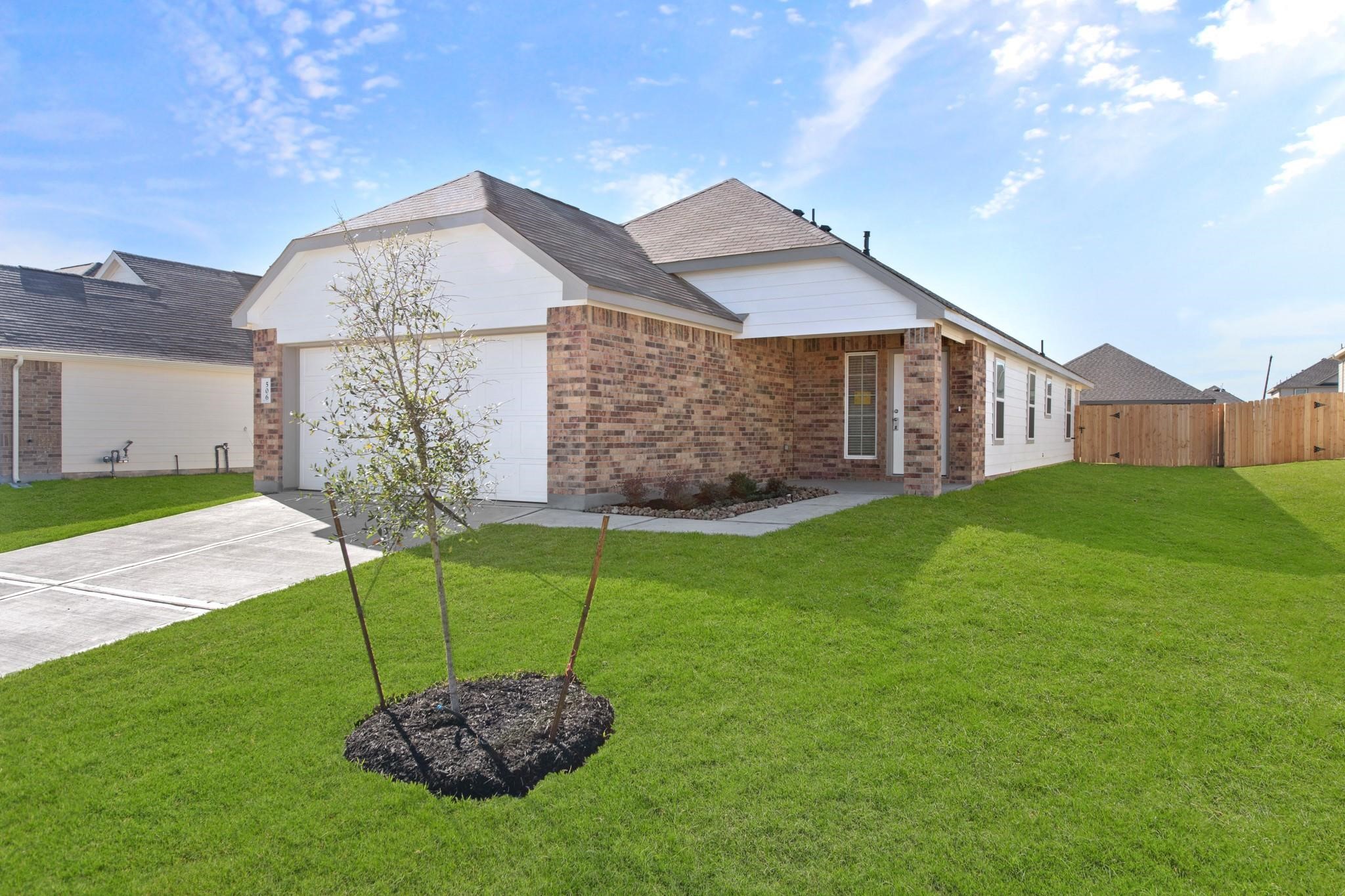 506 Moose Run Huntsville, TX 77320 - Photo 2 of 26 a view of a house with a backyard