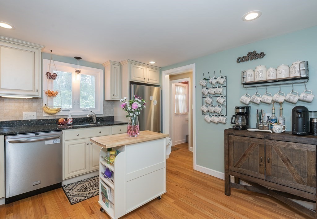 97 Bridle Path Road Springfield, MA 01118 - Photo 13 of 42 a kitchen with stainless steel appliances granite countertop a sink and a refrigerator