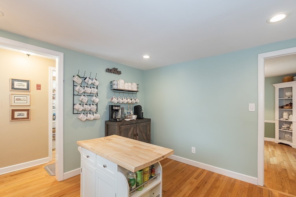 97 Bridle Path Road Springfield, MA 01118 - Photo 16 of 42 a room with furniture and wooden floor