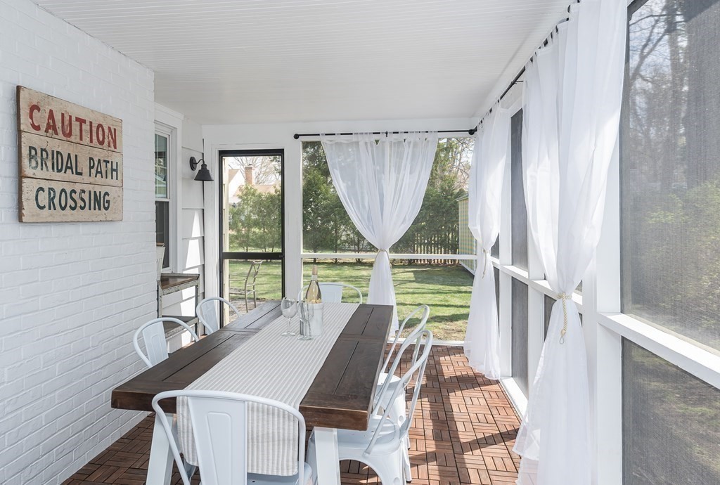 97 Bridle Path Road Springfield, MA 01118 - Photo 20 of 42 a view of a dining room with furniture window and wooden floor