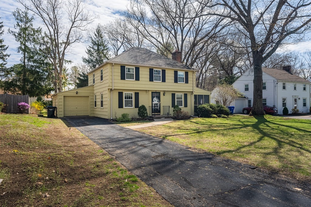97 Bridle Path Road Springfield, MA 01118 - Photo 2 of 42 a front view of a house with a yard and trees