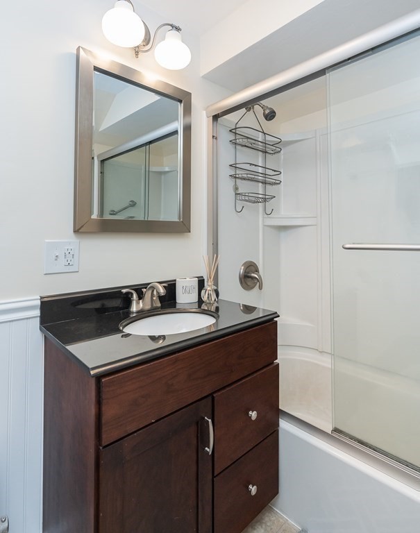 97 Bridle Path Road Springfield, MA 01118 - Photo 26 of 42 a bathroom with a granite countertop sink mirror and double