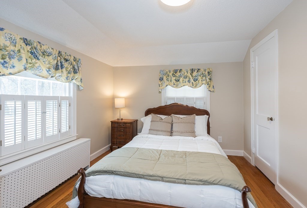 97 Bridle Path Road Springfield, MA 01118 - Photo 28 of 42 a bedroom with a large bed and a window