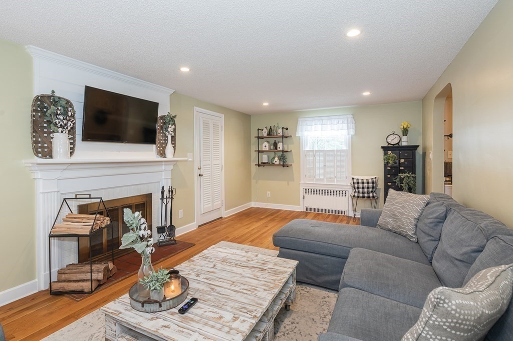 97 Bridle Path Road Springfield, MA 01118 - Photo 8 of 42 a living room with furniture and a fireplace