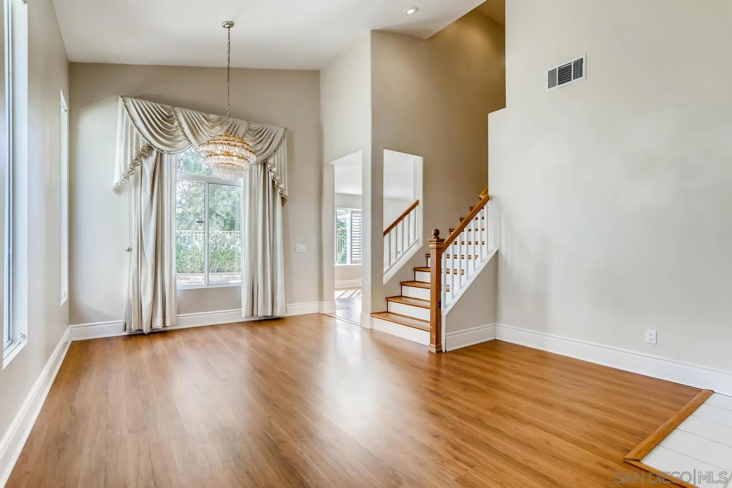 545 Shenandoah Road Corona, CA 92879 - Photo 2 of 11 a view of an entryway with wooden floor and door