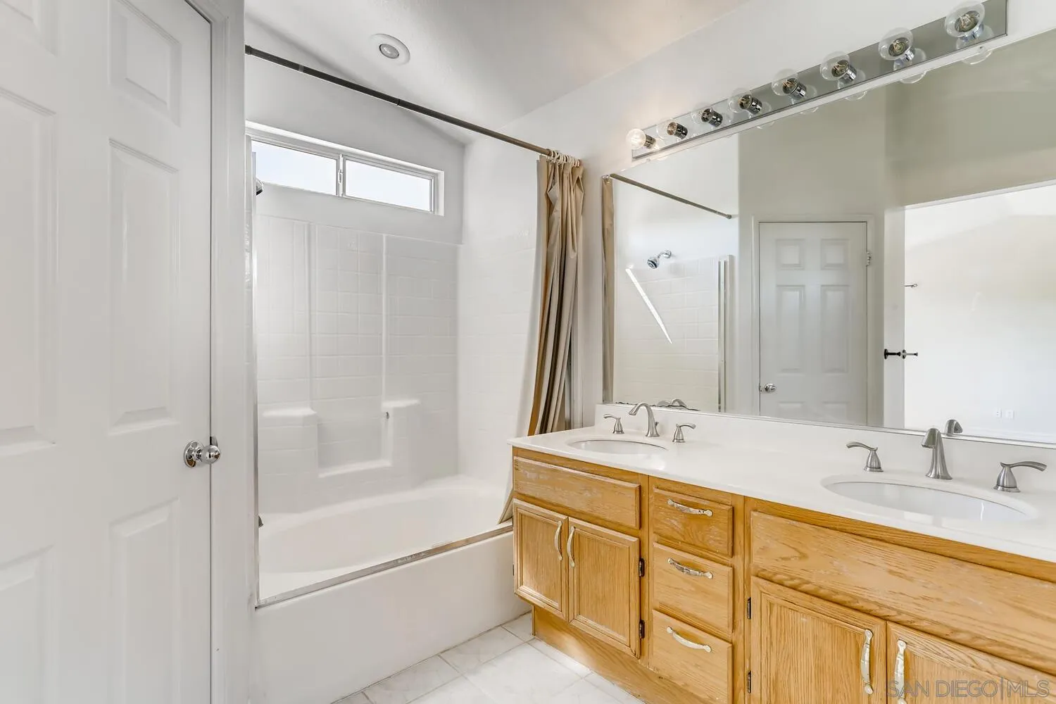 545 Shenandoah Road Corona, CA 92879 - Photo 8 of 11 a bathroom with a double vanity sink mirror double and shower