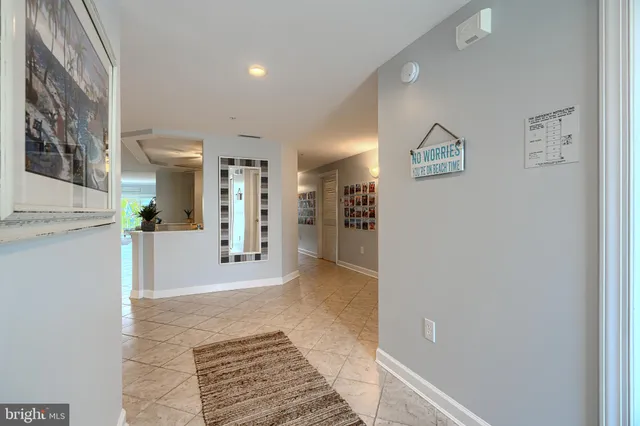 a kitchen with stainless steel appliances kitchen island granite countertop a sink and cabinets