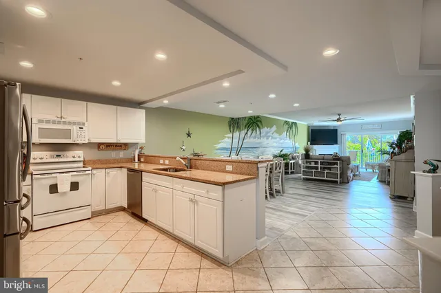 a view of a dining area with furniture and window