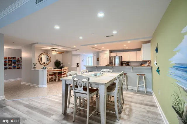 a spacious bathroom with a double vanity sink a toilet and a tub