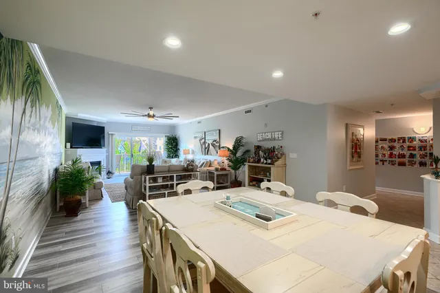 a spacious bathroom with a double vanity sink toilet mirror and bathtub