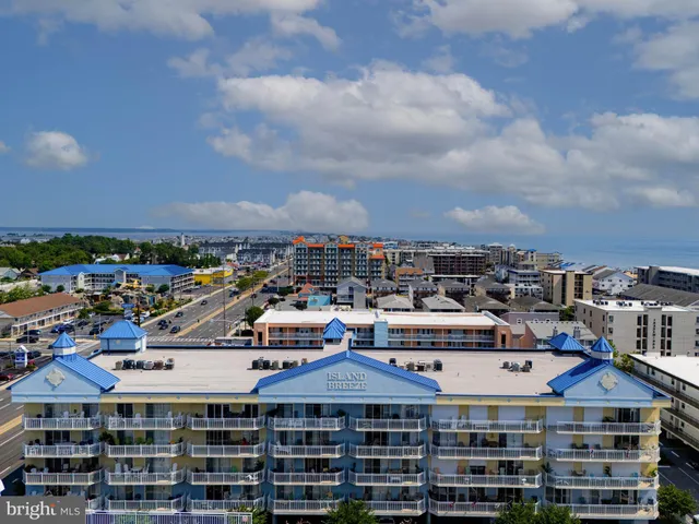 a swimming pool view with a outdoor seating space