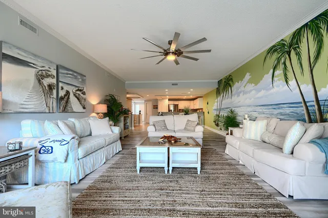 a bedroom with a bed and large windows