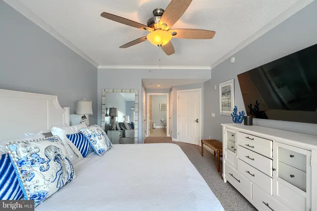 a bathroom with a toilet a sink and a large mirror