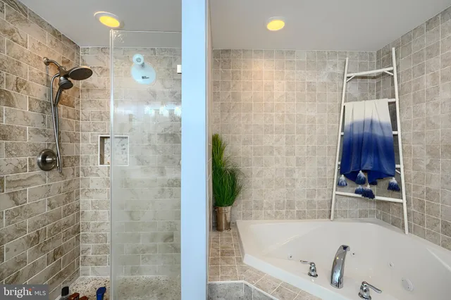 a building with balcony and outdoor seating