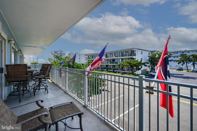 a kitchen with a refrigerator a stove and cabinets