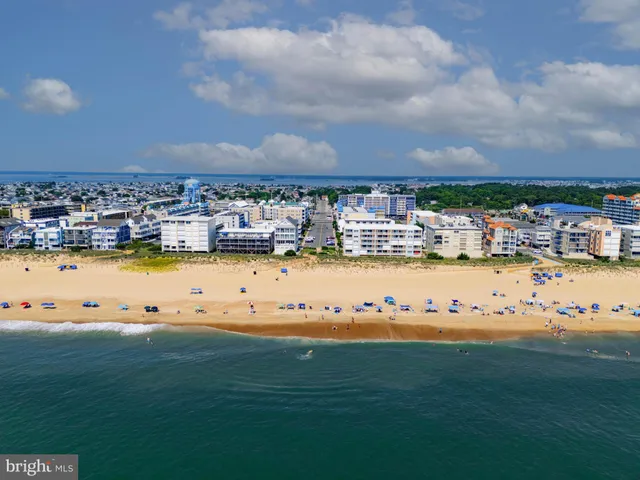 a kitchen with refrigerator and cabinets